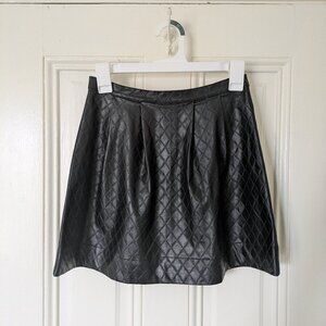Black quilted faux leather mini skirt
